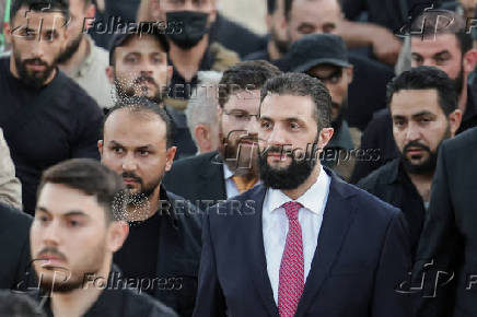 Syria's interim President Ahmed al-Sharaa attends the 