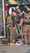 Law enforcement officers conduct a federal immigration raid in Bethlehem