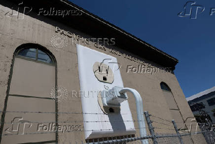 A giant electrical outlet is displayed at a PG&E substation building in Petaluma, California