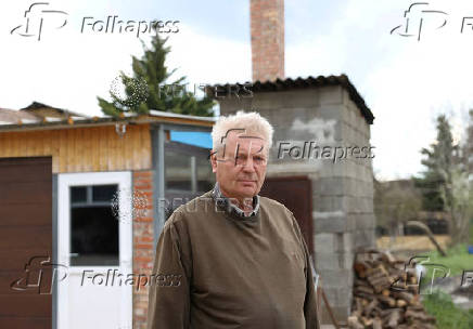 Meixner, farmer, poses for a picture in front of his farm during the outbreak of foot-and-mouth disease near Rajka