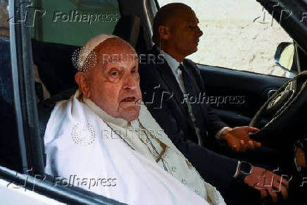 Pope Francis looks on as he leaves Regina Coeli prison after a visit, in Rome