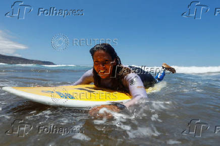 Surfer Mireia Cabanes waits for a good wave to surf during the adaptive surfing Open LPA Surf City No Limit in Las Palmas de Gran Canaria