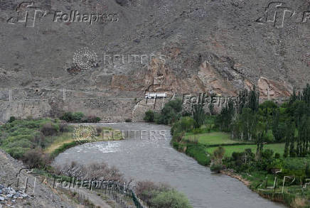 FILE PHOTO: A truck drives on a road in the border region of Iran, as seen from the Syunik Province of Armenia