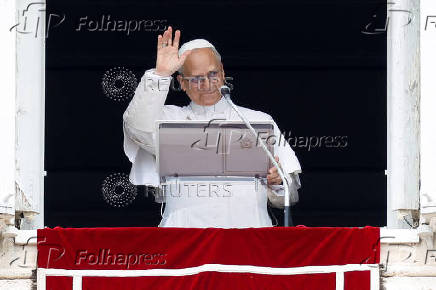 Pope Leo XIV leads the Angelus prayer from his window at the Vatican