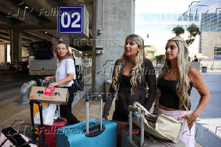 Israeli nationals arrive at Ben Gurion International airport from abroad, in Tel Aviv