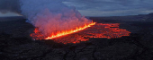 Lava emerges through a fissure following a volcano eruption near Grindavik