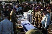 People mourn Israeli soldier Staff Sergeant Lior Steinberg, in Petah Tikva