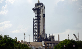 A Falcon 9 rocket stands at the pad before its upcoming launch of the Axiom-4 crewed mission to the International Space Station