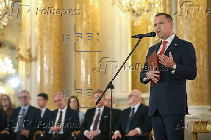 Polish President-elect Karol Nawrocki receives the winning certificate
