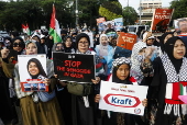 Pro Palestinians protest outside the US embassy in Jakarta