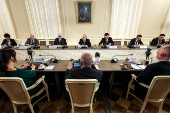 Russian President Vladimir Putin meets with heads of international news agencies in Saint Petersburg