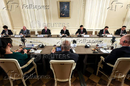 Russian President Vladimir Putin meets with heads of international news agencies in Saint Petersburg
