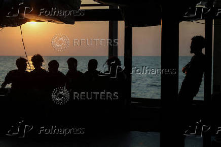 Rescued migrants aboard Sea-Watch 5 migrant search and rescue ship on their way to Italy