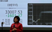 Electronic screen displaying Japan's Nikkei share average outside a brokerage in Tokyo