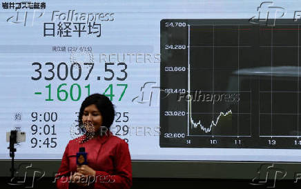 Electronic screen displaying Japan's Nikkei share average outside a brokerage in Tokyo