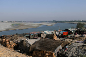 FILE PHOTO: FILE PHOTO: A view of tent houses, belonging to squatters, on the dry riverbed of the Indus River in Hyderabad