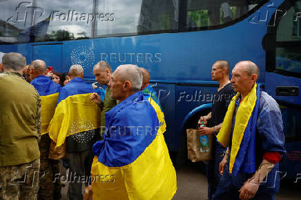 Ukrainian prisoners of war are seen as they return after a swap in an undisclosed location in Ukraine