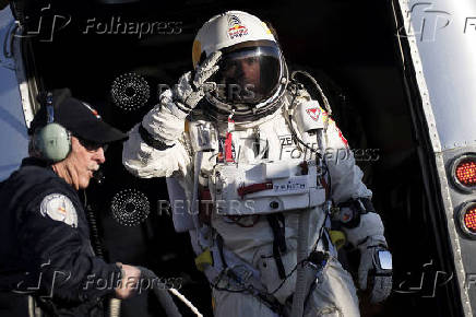 Pilot Felix Baumgartner of Austria walks to the capsule during the first manned test flight for Red Bull Stratos in Roswell
