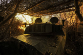 Ukrainian servicemen fire a self-propelled howitzer towards Russian troops at a frontline near the town of Chasiv Yar