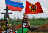 People visit a cemetery in Donetsk