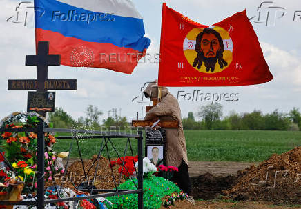 People visit a cemetery in Donetsk