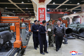 North Korea's leader Kim Jong Un visits a factory that makes shells and machinery