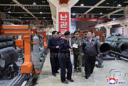 North Korea's leader Kim Jong Un visits a factory that makes shells and machinery