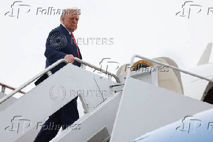 U.S. President Trump boards Air Force One, at Joint Base Andrews