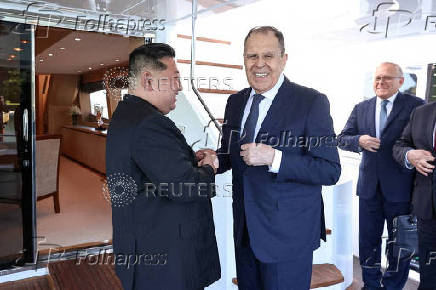 North Korean leader Kim Jong Un shakes hands with Russian Foreign Minister Sergei Lavrov during a meeting in Wonsan