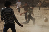 Yemeni youths play soccer in Sana'a