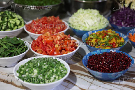 Cut vegetables are placed on a table at Zainab Khalifeh's restaurant, a Lebanese who turned a part of her home into a restaurant and called it 'Zainab's table' in the town of Sarafand,