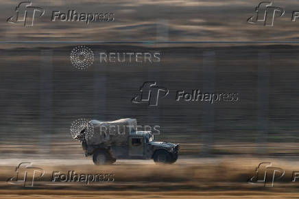 An Israeli military vehicle manoeuvres in the Israel-Gaza border