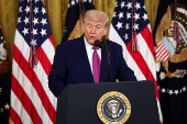 U.S. President Trump signs a resolution at the White House