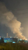 Smoke rises from a refinery's compound in Haifa