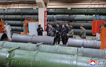 North Korea's leader Kim Jong Un visits a factory that makes shells and machinery