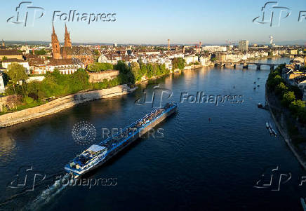 FILE PHOTO:  A drone view shows a barge on the Rhine river in front of the Muenster cathedral ahead of the Eurovision Song Contest in Basel