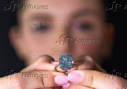 A Sotheby?s staff wears 
