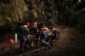 Chilean volunteers combat plastic waste in the Mapocho river, in Santiago