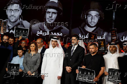Al Jazeera staff members gather at the network?s studios to remember their colleagues killed in Gaza City by an Israeli strike, in Doha