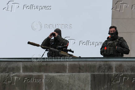 German security personnel screen the area, in Berlin