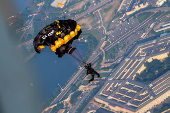 U.S. Army Golden Knights parachute team perform during the Twilight Tattoo ceremony