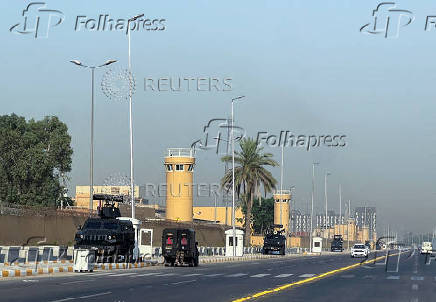 Armored vehicles belonging to Iraqi security forces are stationed outside the U.S. Embassy in Baghdad?s Green Zone,