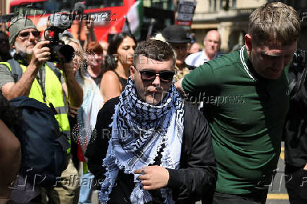Member of Irish rap group Kneecap in UK court on terrorism charge