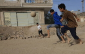 Yemeni youths play soccer in Sana'a