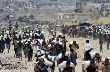 Palestinians gather for aid supplies in Beit Lahia