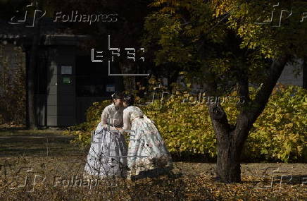 Tourists in Hanbok take selfies at Seoul’s Gyeongbokgung Palace