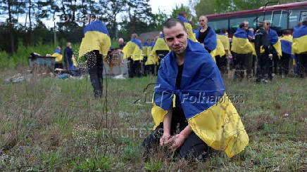 Ukrainian POWs are seen after a swap at an unknown location in Ukraine