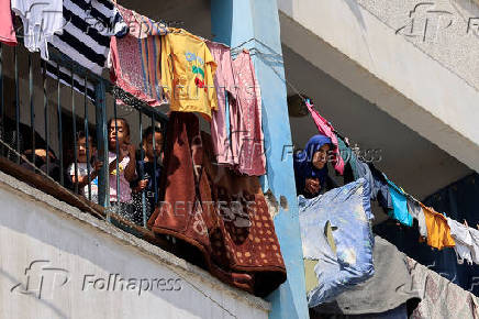 Displaced Palestinians shelter in a UNRWA school, in Khan Younis