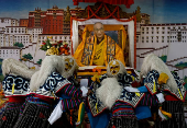 Tibetans mark the 90th birthday celebration of their spiritual leader, the Dalai Lama, at Jawalakhel Handicraft Center in Lalitpur