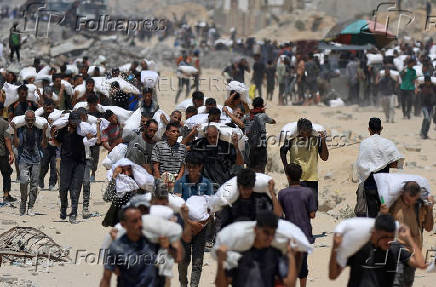 Palestinians gather for aid supplies in Beit Lahia